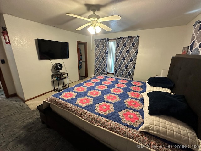 661 12th NW, Ardmore, OK 73401 - carpeted bedroom with baseboards and ceiling fan