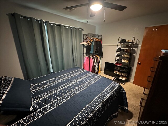 661 12th NW, Ardmore, OK 73401 - bedroom with carpet flooring and a ceiling fan