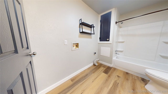 420 W State, Stratford, OK 74872 - bathroom with toilet, wood finished floors, baseboards, and tub / shower combination