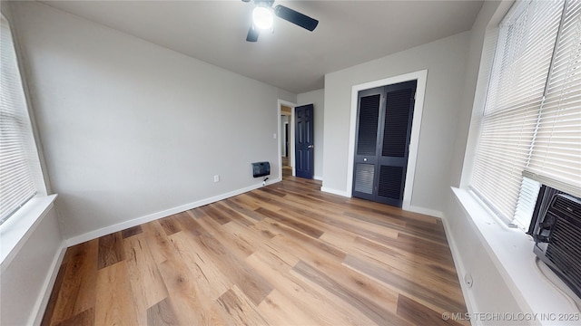 420 W State, Stratford, OK 74872 - unfurnished bedroom with light wood-type flooring, a closet, baseboards, and a ceiling fan