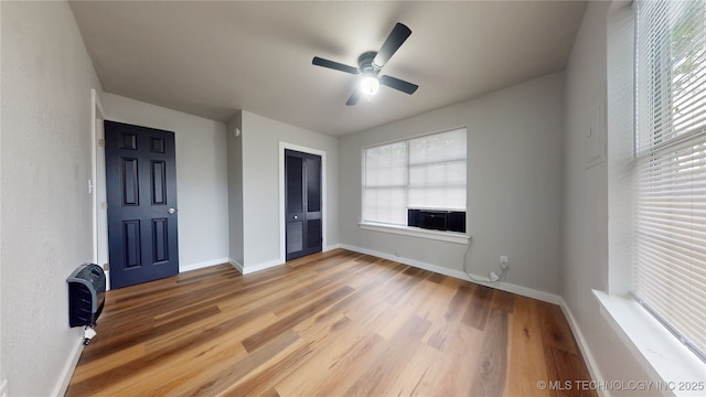 420 W State, Stratford, OK 74872 - spare room with plenty of natural light, wood finished floors, a ceiling fan, and baseboards