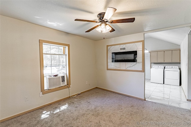 609 E Tejon Ave, Bristow, OK 74010 - unfurnished living room with washing machine and clothes dryer, ceiling fan, cooling unit, light carpet, and baseboards