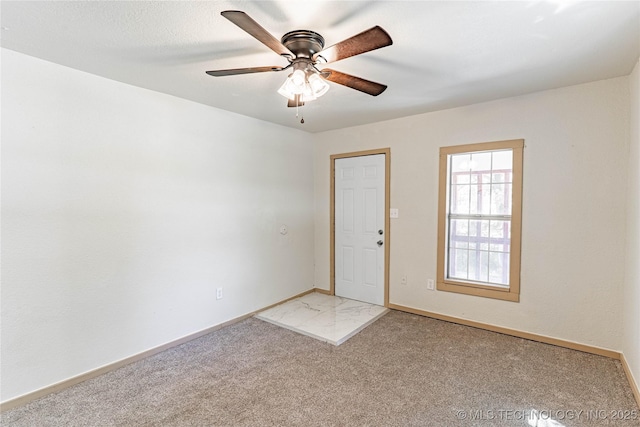 609 E Tejon Ave, Bristow, OK 74010 - unfurnished room with baseboards, light colored carpet, and ceiling fan