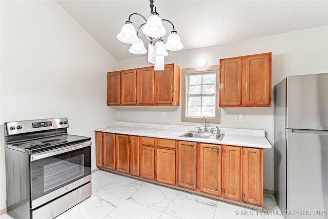 609 E Tejon Ave, Bristow, OK 74010 - kitchen featuring appliances with stainless steel finishes, a sink, light marble finish floors, and brown cabinets