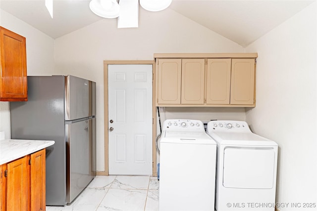 609 E Tejon Ave, Bristow, OK 74010 - laundry area with cabinet space, light marble finish floors, and washing machine and clothes dryer