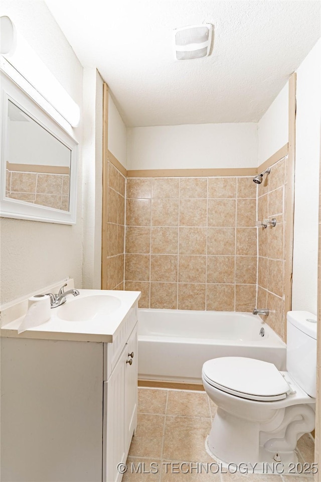 609 E Tejon Ave, Bristow, OK 74010 - full bathroom with toilet, vanity, tub / shower combination, and tile patterned floors