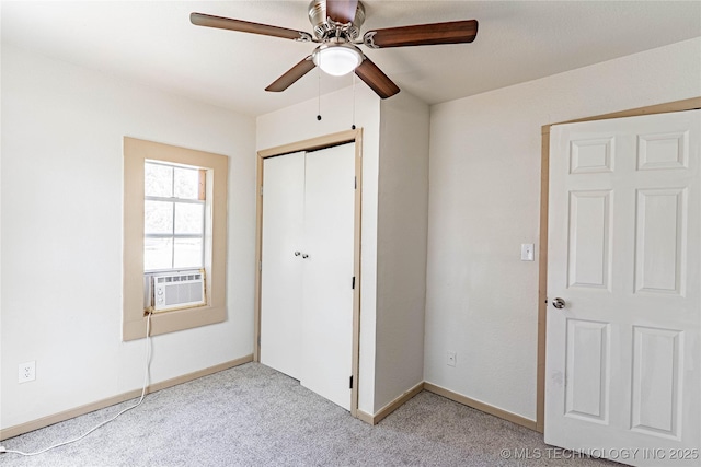609 E Tejon Ave, Bristow, OK 74010 - unfurnished bedroom with cooling unit, light carpet, a closet, and baseboards