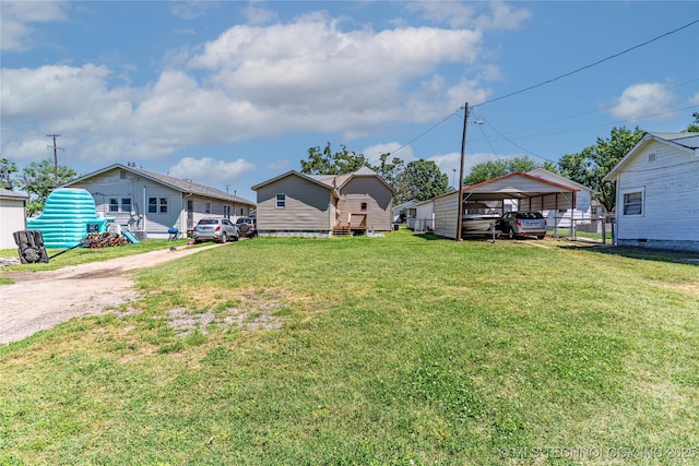 302 E 8th Ave, Bristow, OK 74010 - view of yard featuring a detached carport and driveway