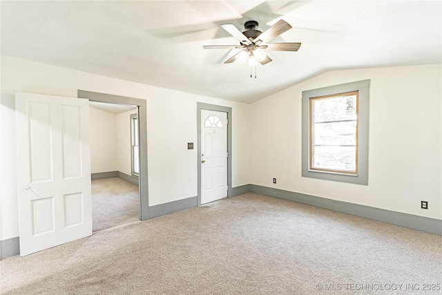 302 E 8th Ave, Bristow, OK 74010 - empty room featuring carpet, lofted ceiling, a ceiling fan, and baseboards