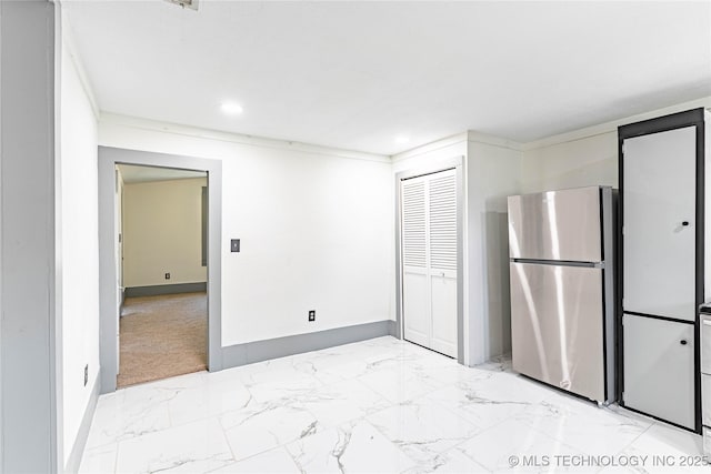 302 E 8th Ave, Bristow, OK 74010 - kitchen featuring freestanding refrigerator, light marble finish floors, recessed lighting, and baseboards