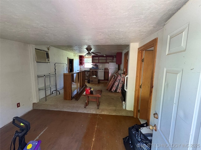 4272 Honey Creek Dr, Davis, OK 73030 - basement with a textured ceiling, a ceiling fan, wood finished floors, freestanding refrigerator, and a wall mounted AC
