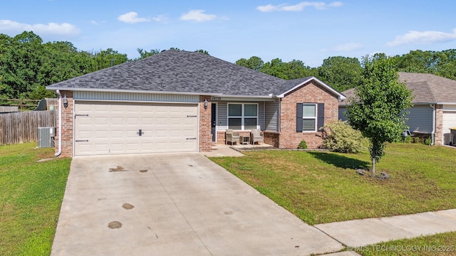 14738 S 274th E Ave, Coweta, OK 74429 - single story home with brick siding, central AC, concrete driveway, a garage, and a shingled roof