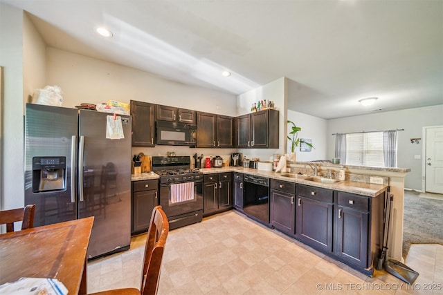 14738 S 274th E Ave, Coweta, OK 74429 - kitchen featuring black appliances, a sink, a peninsula, dark brown cabinets, and recessed lighting