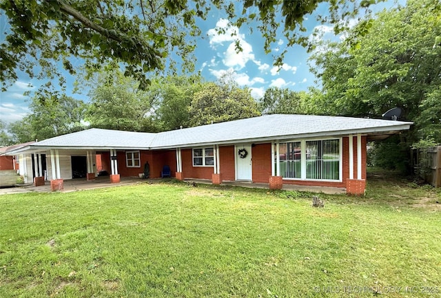 912 Elm, Ardmore, OK 73401 - ranch-style house with a front lawn and a carport