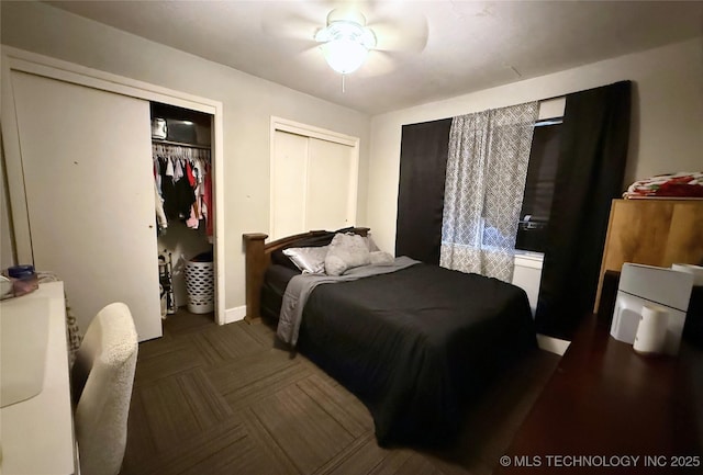 912 Elm, Ardmore, OK 73401 - bedroom featuring multiple closets and a ceiling fan