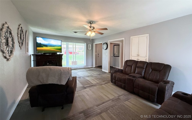 912 Elm, Ardmore, OK 73401 - living room with baseboards, ceiling fan, and wood finished floors