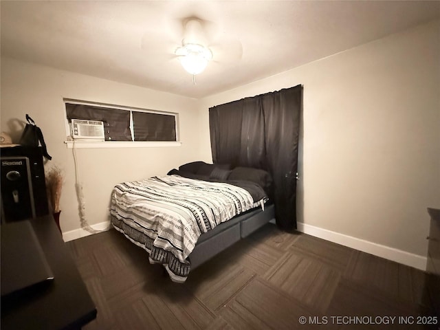 912 Elm, Ardmore, OK 73401 - bedroom featuring baseboards, cooling unit, and ceiling fan