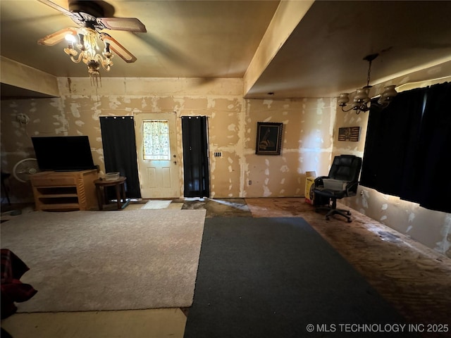 233 W Madison Ave, Mcalester, OK 74501 - living room featuring ceiling fan and a chandelier