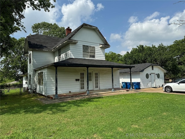 233 W Madison Ave, Mcalester, OK 74501 - view of front of house with a chimney, roof with shingles, covered porch, and an outbuilding