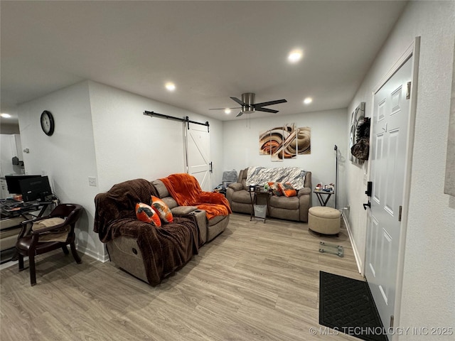 233 W Madison Ave, Mcalester, OK 74501 - living area featuring a barn door, light wood finished floors, a ceiling fan, recessed lighting, and baseboards