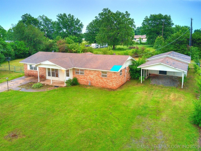 12641 S 281st E Ave, Coweta, OK 74429 - view of front of house featuring driveway, a carport, brick siding, and a patio
