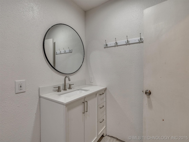 12641 S 281st E Ave, Coweta, OK 74429 - bathroom featuring vanity and a textured wall