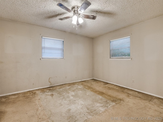 12641 S 281st E Ave, Coweta, OK 74429 - unfurnished room with plenty of natural light, a textured ceiling, ceiling fan, and baseboards
