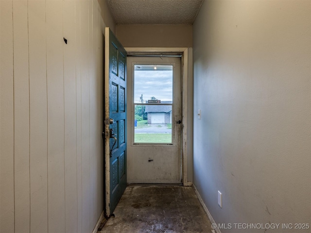 12641 S 281st E Ave, Coweta, OK 74429 - doorway with unfinished concrete floors and a textured ceiling