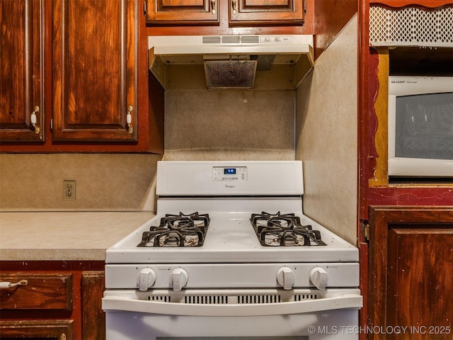 12641 S 281st E Ave, Coweta, OK 74429 - kitchen with white gas range oven, light countertops, and under cabinet range hood