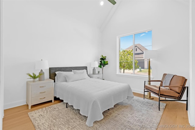 1227 N 71st Pl, Broken Arrow, OK 74014 - bedroom featuring wood finished floors, baseboards, and vaulted ceiling