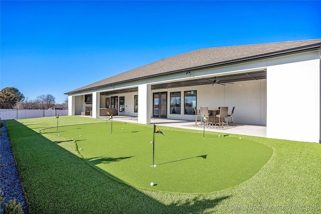 1227 N 71st Pl, Broken Arrow, OK 74014 - back of house with a putting area, a patio area, ceiling fan, and stucco siding
