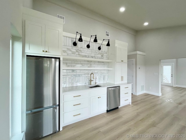 228 W Hickory Dr, Sand Springs, OK 74063 - kitchen featuring appliances with stainless steel finishes, a sink, backsplash, recessed lighting, and light countertops