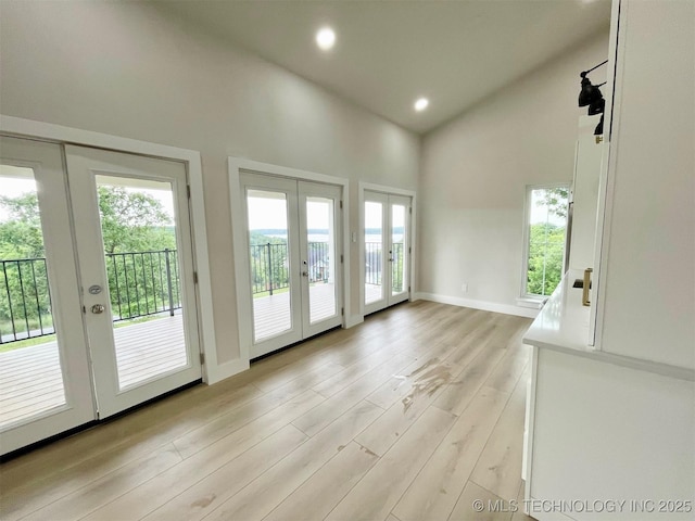 228 W Hickory Dr, Sand Springs, OK 74063 - doorway to outside featuring french doors, light wood-type flooring, high vaulted ceiling, recessed lighting, and baseboards