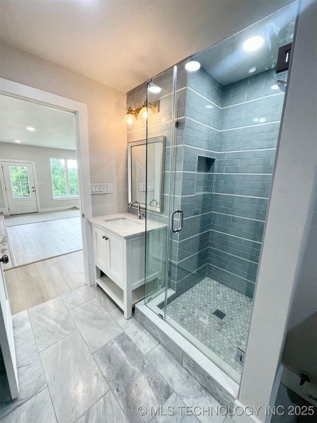 228 W Hickory Dr, Sand Springs, OK 74063 - full bathroom with vanity, a shower stall, recessed lighting, and baseboards
