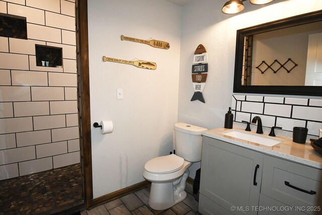 35870 S Talon Dr, Cookson, OK 74427 - full bathroom with vanity, toilet, tasteful backsplash, and tiled shower