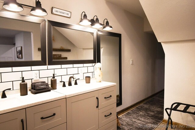 35870 S Talon Dr, Cookson, OK 74427 - bathroom with decorative backsplash, double vanity, and baseboards