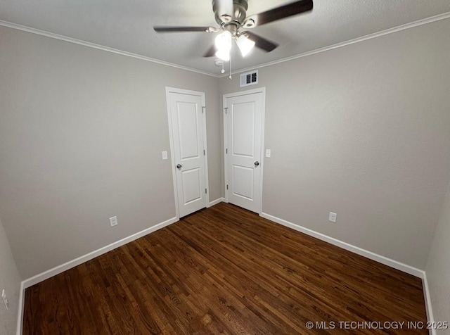 6837 E King Pl, Tulsa, OK 74115 - unfurnished room featuring dark wood finished floors, baseboards, a ceiling fan, and ornamental molding