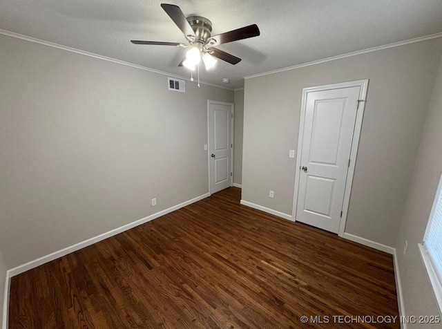 6837 E King Pl, Tulsa, OK 74115 - unfurnished bedroom featuring dark wood finished floors, baseboards, crown molding, ceiling fan, and a textured ceiling