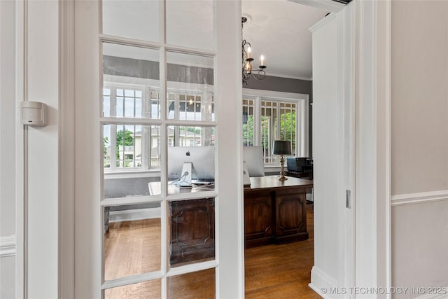319 E 21st St, Tulsa, OK 74114 - home office with a chandelier, wood finished floors, and crown molding