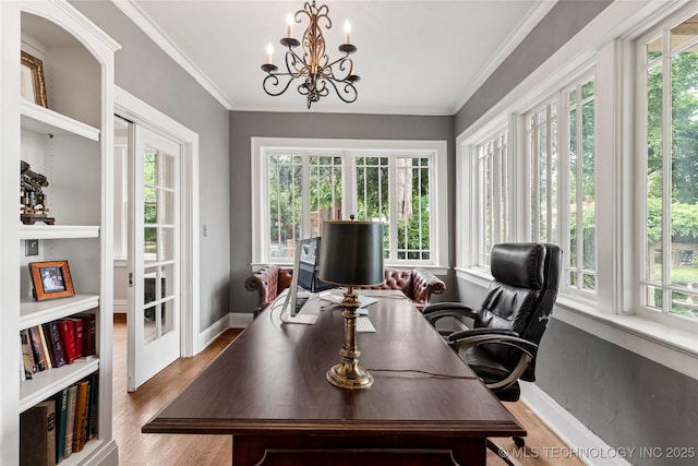 319 E 21st St, Tulsa, OK 74114 - office area featuring wood finished floors, a chandelier, and ornamental molding