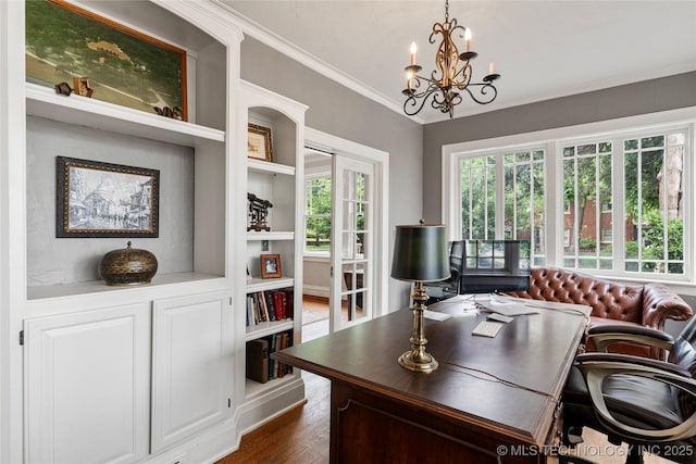 319 E 21st St, Tulsa, OK 74114 - home office with a chandelier, dark wood finished floors, ornamental molding, and built in features