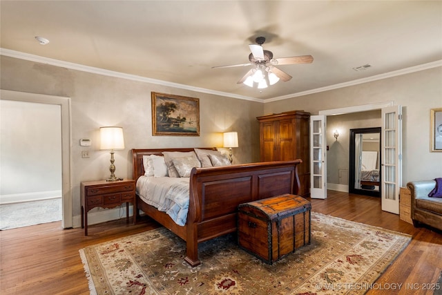 319 E 21st St, Tulsa, OK 74114 - bedroom with wood finished floors, crown molding, and ceiling fan