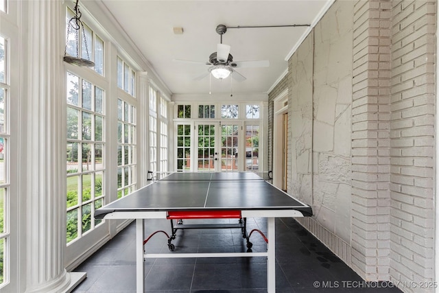 319 E 21st St, Tulsa, OK 74114 - game room with a ceiling fan, brick wall, and ornamental molding