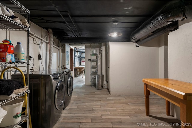 319 E 21st St, Tulsa, OK 74114 - basement featuring washing machine and clothes dryer and wood finished floors