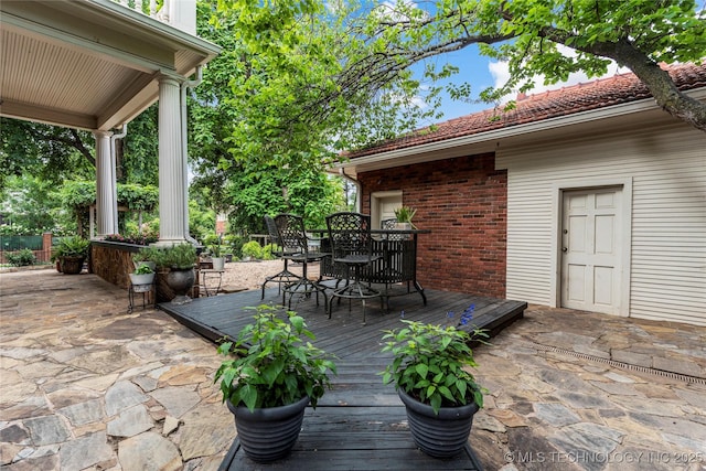 319 E 21st St, Tulsa, OK 74114 - view of patio / terrace with outdoor dining space and a wooden deck