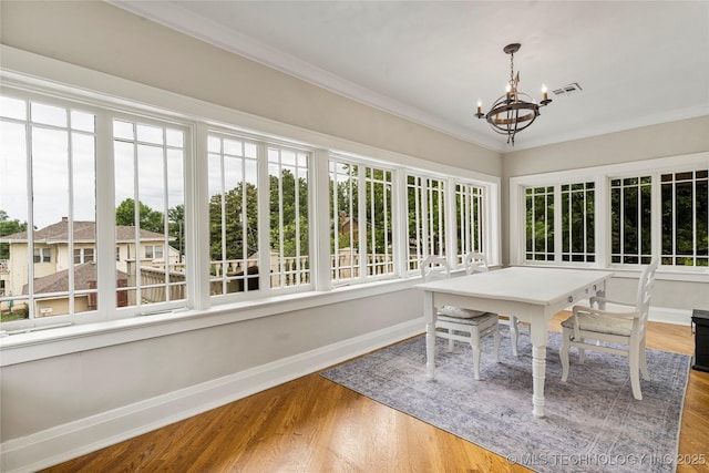 319 E 21st St, Tulsa, OK 74114 - sunroom with plenty of natural light and a chandelier
