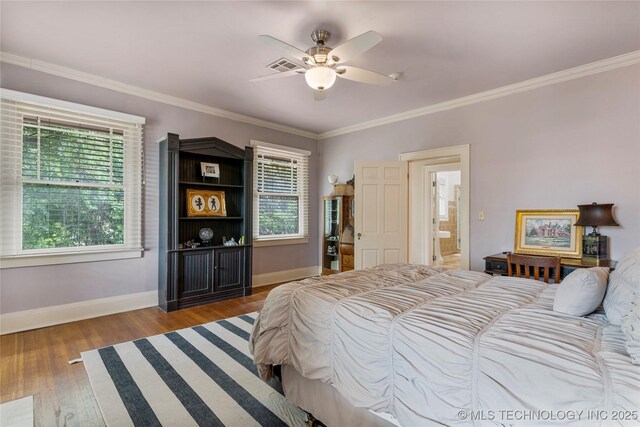 319 E 21st St, Tulsa, OK 74114 - bedroom featuring baseboards, wood finished floors, crown molding, and a ceiling fan