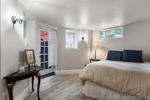 319 E 21st St, Tulsa, OK 74114 - bedroom with wood finished floors and baseboards