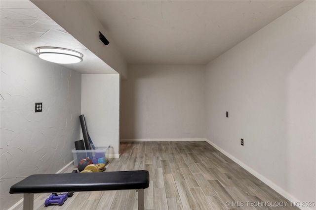 319 E 21st St, Tulsa, OK 74114 - unfurnished living room featuring wood finished floors and baseboards