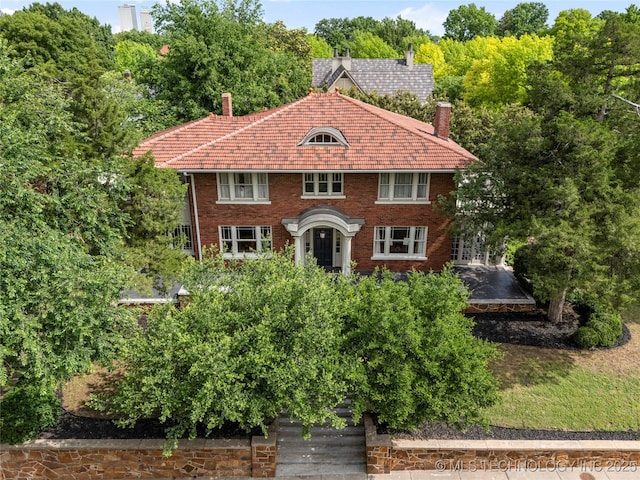 319 E 21st St, Tulsa, OK 74114 - view of front facade featuring a chimney and brick siding